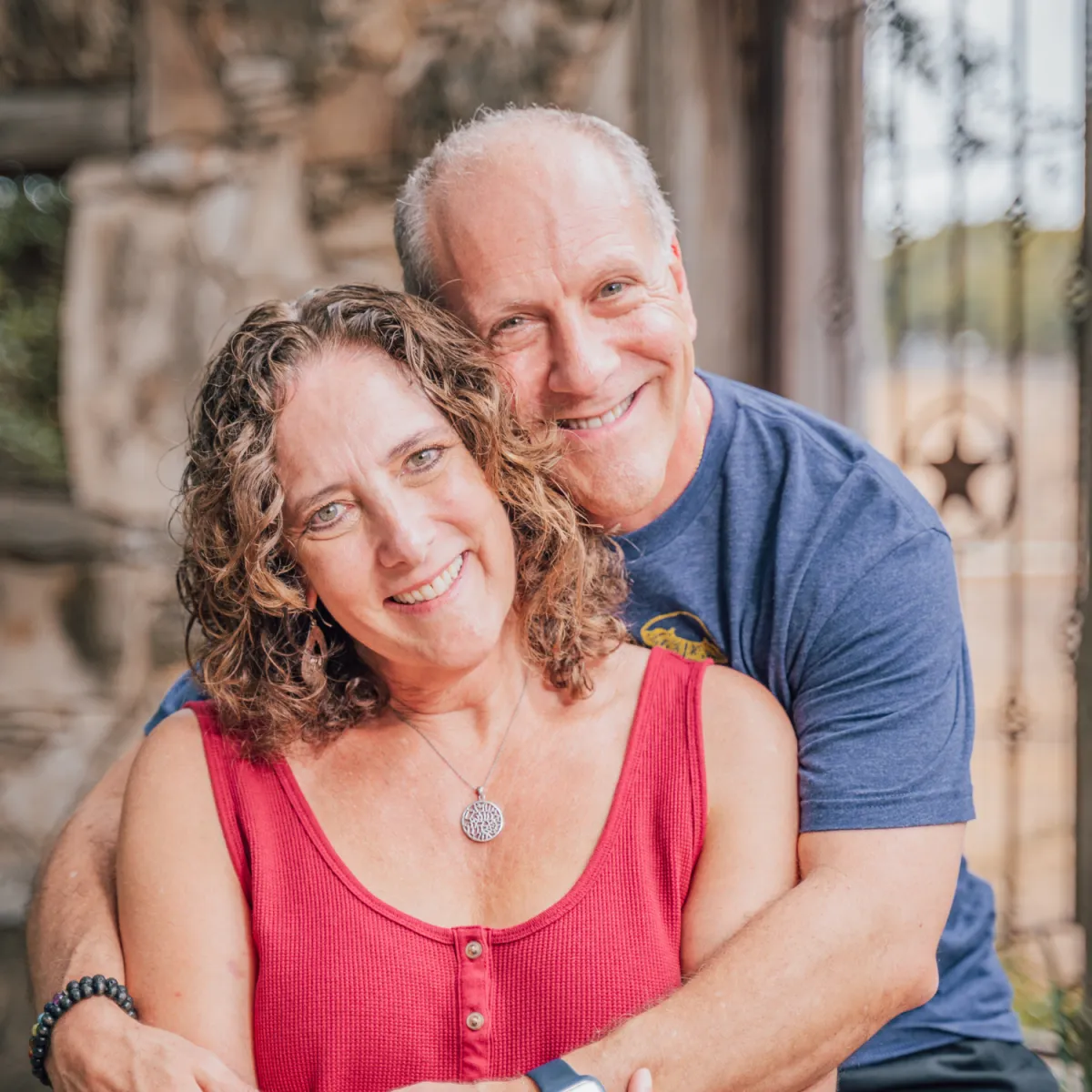 Leslye and Rob, relationship mentors, smiling together outdoors